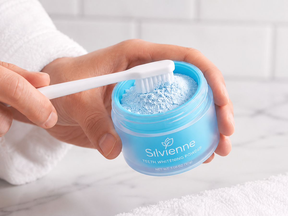 Toothbrush dipped into teeth whitening powder
